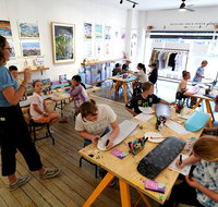 Design on a Skate Deck in an Art Gallery Workshop in Newcastle - Hervey Bay Accommodation
